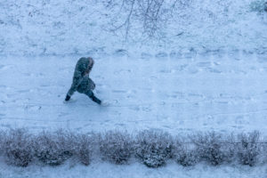 Germany, Baden-Württemberg, Karlsruhe, pedestrians on snowy path. Germany, Baden-Württemberg, Karlsruhe, pedestrians on snowy path.